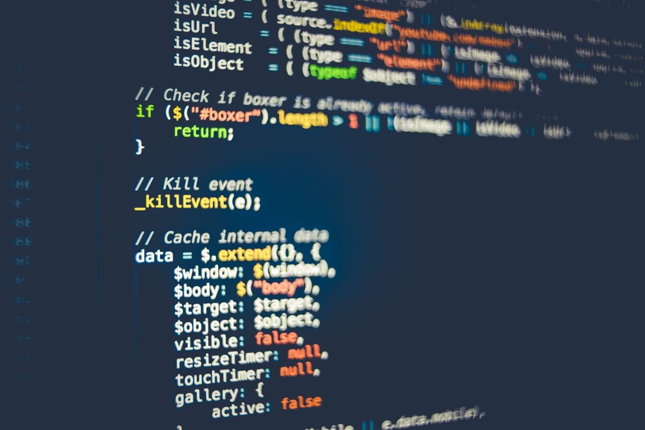 Services Close-up of colorful programming code displayed on a computer screen, showcasing modern coding concepts.